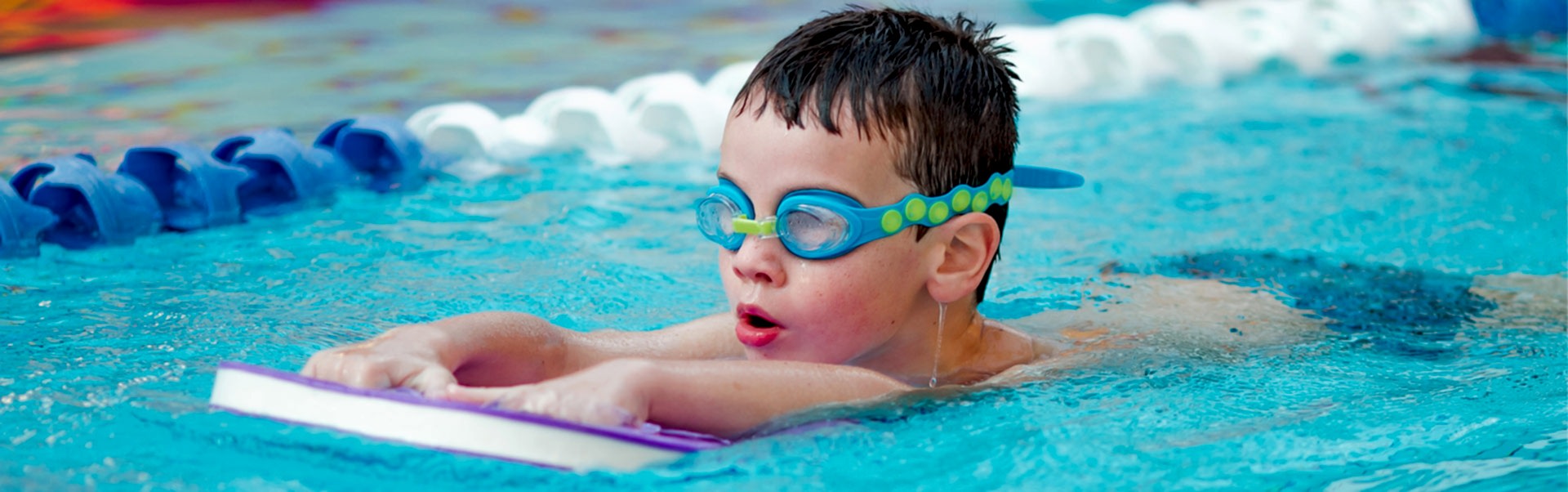 Boy Swimming With Board